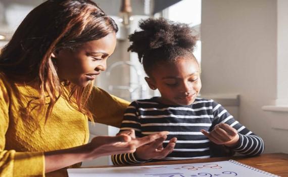 homework help picture of teacher helping a child with homework