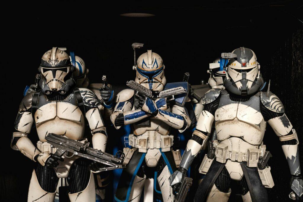 Detailed shot of Star Wars clone trooper action figures in combat-ready stance.