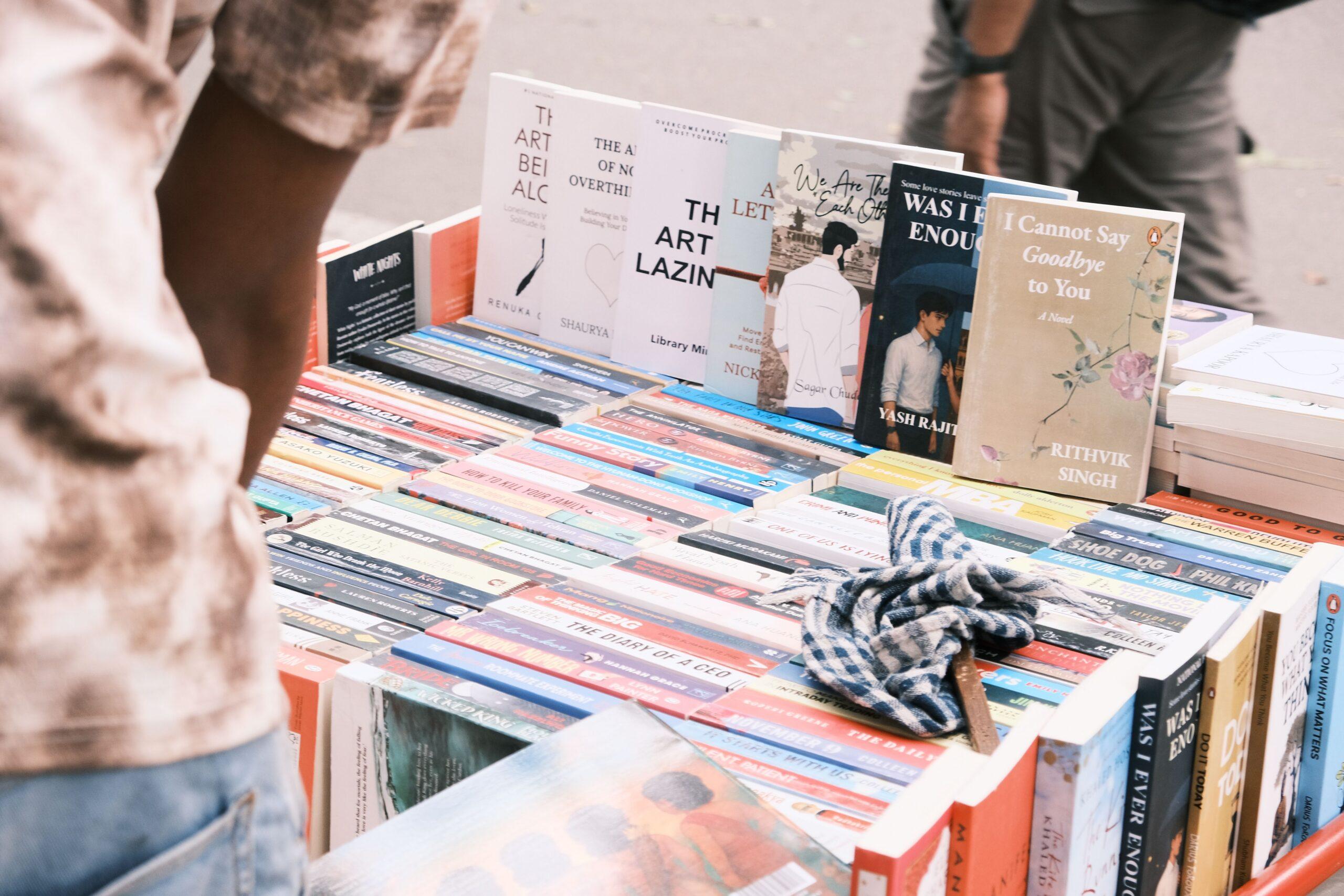 Vibrant outdoor book market scene in Bengaluru featuring diverse book collection.