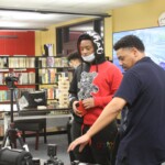 picture of teen librarian helping a teen