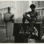 Young man sitting on Cossitt Library sculpture
