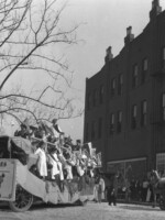 Suffrage parade at the corner of Main and Pontotoc Avenue. The parade pictured here is likely the suffrage parade held on March 29, 1916 to mark a major suffrage meeting and visit by national leader Mrs. Carrie Chapman Catt.