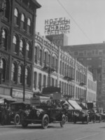 Suffrage parade on S. Main Street. Vehicle has sign, "Honor for the Pioneers".